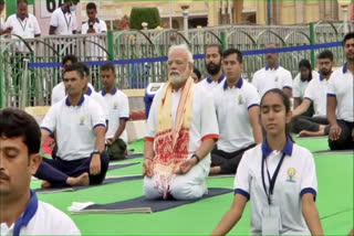 International yoga day 2022, PM Modi international Yoga day, PM Modi participate yoga day in Mysore, PM Modi speech in international yoga day in Mysore, International yoga day live from Mysore, ಅಂತರಾಷ್ಟ್ರೀಯ ಯೋಗ ದಿನ 2022, ಪ್ರಧಾನಿ ಮೋದಿ ಅಂತರಾಷ್ಟ್ರೀಯ ಯೋಗ ದಿನ, ಮೈಸೂರಿನಲ್ಲಿ ಯೋಗ ದಿನಾಚರಣೆಯಲ್ಲಿ ಭಾಗವಹಿಸಿದ ಪ್ರಧಾನಿ ಮೋದಿ, ಮೈಸೂರಿನಿಂದ ಅಂತರಾಷ್ಟ್ರೀಯ ಯೋಗ ದಿನ ನೇರಪ್ರಸಾರ,