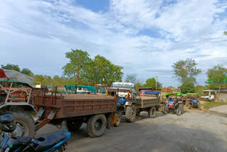 tractors carrying illegal sand