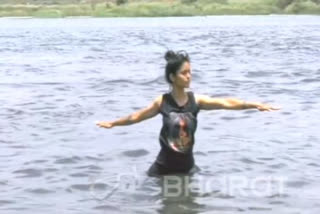 A girl does yoga inside water in Jabalpur