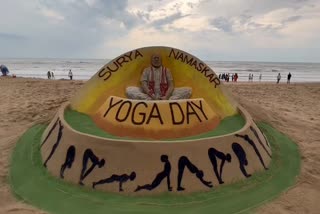 udarshan pattnaik marks international yoga day with sand art at puri sea beach