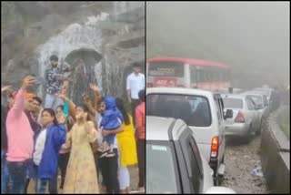 Tourists taking selfies in the middle of Charmedi Ghat Road