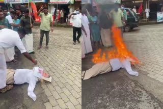 Saji Cherian anti constitutional speech  Yuva Morcha burnt the minister Saji Cherian effigy  protest against saji cheriyan  സജി ചെറിയാൻ ഭരണഘടന വിരുദ്ധ പ്രസംഗം  യുവമോർച്ച സജി ചെറിയാന്‍റെ കോലം കത്തിച്ചു  സജി ചെറിയാനെതിരെ പ്രതിഷേധം