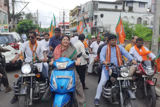 Sukanta Majumdar participates in a bike rally at Hooghly