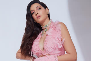 Nora Fatehi in pink Saree