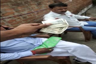 Distributing money to voters video viral