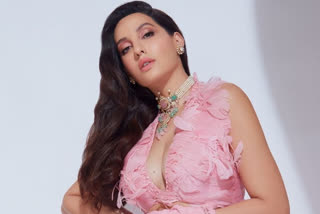 Nora Fatehi in pink saree