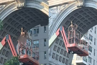 Man climbs boom lift, goes full monty and asks, "Are you entertained?"