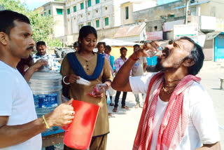 Police Distributes Water and Batasa to Tribal Protesters in Old Malda