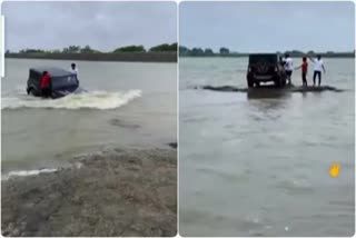 young man drove car in river