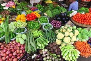 washing vegetables in drain water