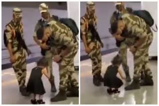 Girl Touches Army Personnel Feet