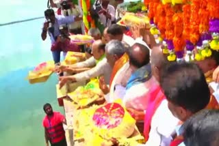 the-cm-bommai-given-bagina-to-the-river-kaveri-in-mandya