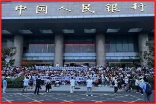 Chinese tanks roll on streets to scare Henan Bank protestors