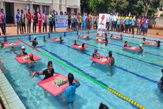 students played chess in the swimming pool