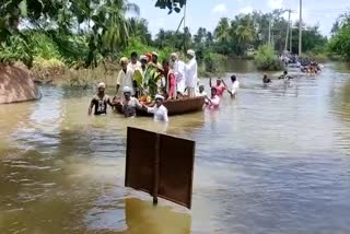 People carried the body of a woman in raft near Kampli Kote