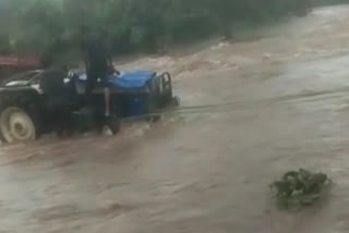 Tractor landed in a raging river