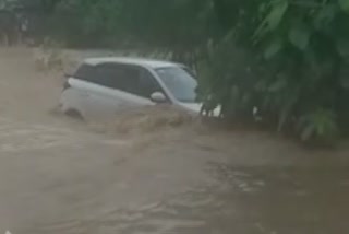 Car washed away in canal eluru