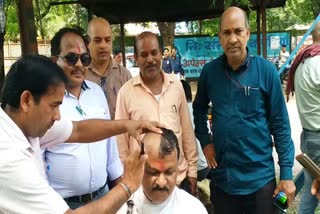 protest by shaving their heads