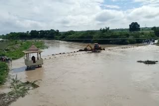 doni river old bridge is flooded due to rain in vijayapura