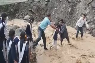 In Uttarkashi, teachers are making children cross the overflow drain to go to school