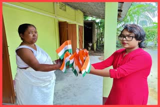 a-young-woman-distributes-national-flag-at-karimganj