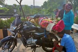 madhya-pradesh-man-carries-mother-body-on-bike-for-80-km-as-ambulance-cost-rs-5000