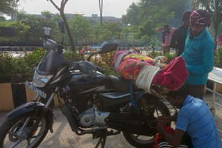 Tribal Woman Dead Body transported to home by Motorbike sparks new Controversy