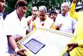 a-fan-gave-gift-with-words-in-gold-for-siddaramaiah
