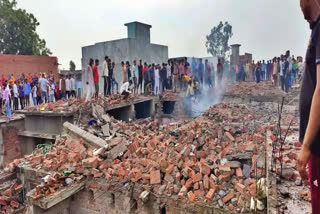 A woman was trapped under the debris after firecracker explosions rocked a two-storey house which was doubling up as cracker storage unit on Tuesday afternoon.