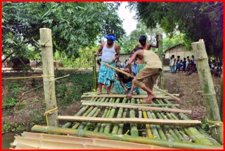 public build a bamboo bridge in Rangia