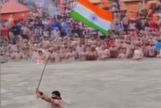 Youth with Tricolour buoyed with patriotic zeal takes a plunge into Ganga river