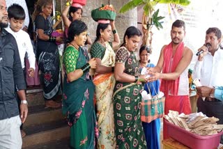 Distribution of turmeric Kumkuma green bangles to women in temples