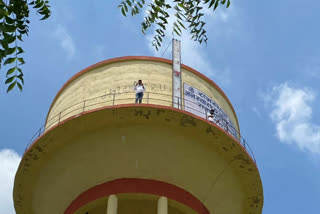 Demand of student election date postpone, students leader climbed on water tank