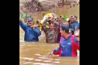 Karnataka: Villagers carry dead body through flood waters