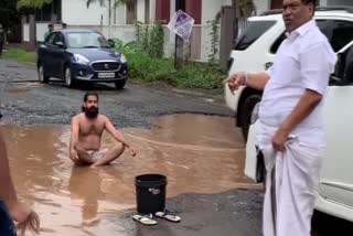 A unique protest against gutters on road by youth at Pandikkad in Youth bath on the waterpool on the road