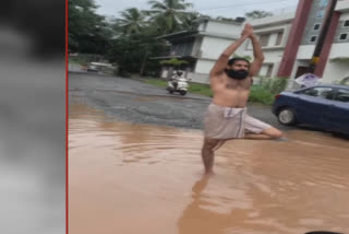 Kerala man protests against potholes