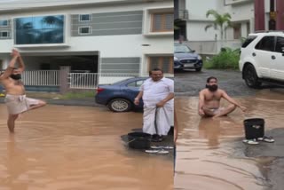 சாலையில் தேங்கியிருந்த தண்ணீரில் யோகாசனம் செய்த நபர்