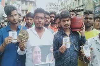 TMC protests distributing cow dung cake in Howrah against LPG price hike