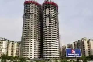 One of Noida twin towers fully rigged with explosives, work in full swing on other