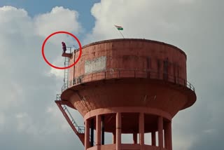 Woman on Water Tank