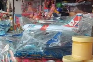 Devotees offers toy planes at Gurdwara Shaheed Baba Nihal Singh Ji in hopes of a trip abroad in Jalandhar