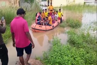 fire department rescued  people trapped in the flood water