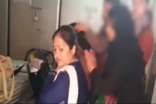 Teacher giving massage to girl students in Mangalore school