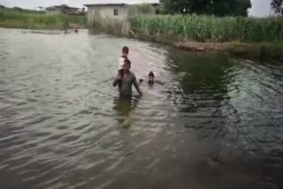 Villagers Crossing River By Swimming