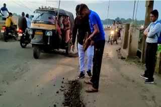 Social workers filling potholes
