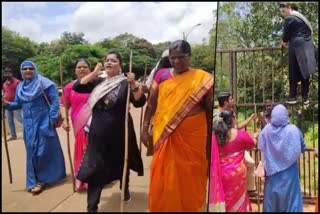 Congress workers with sticks in their hands to catch a leopard