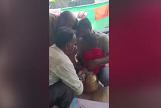 A boy stuck in metal pot Twist to remove