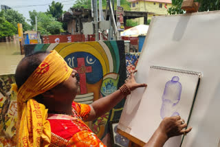 devotee of ganapati in varanasi prepares bappa painting in closed eyes