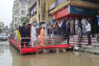 opposition target cm yogi for red carpet welcome in varanasi floods