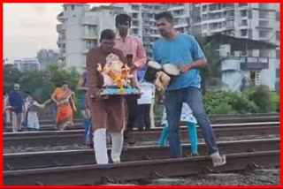 Devotees bid farewell to Ganaraya by crossing the railway track